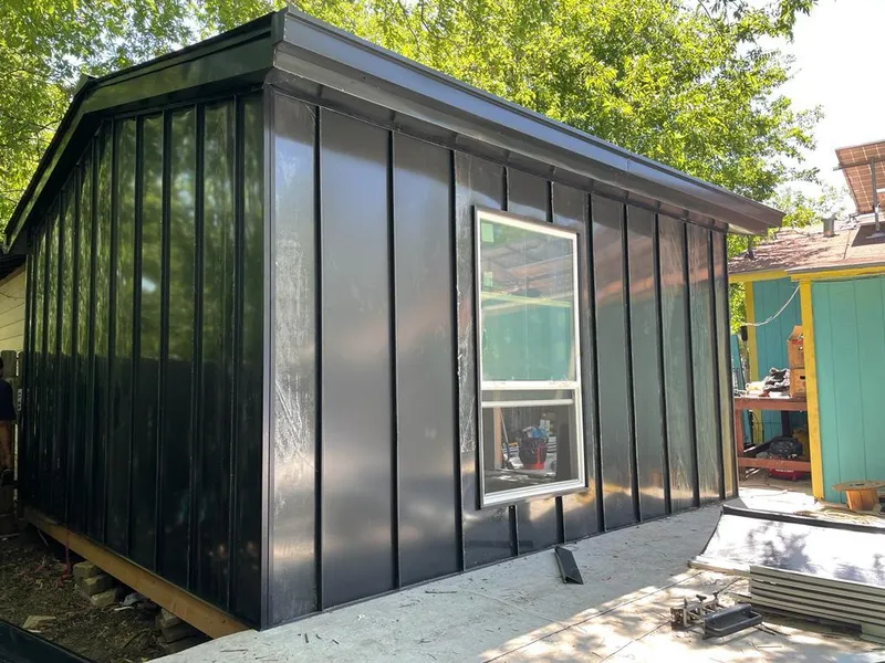 Black standing seam metal wall panels for Roof Inspection in Unity